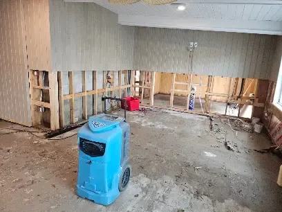 Dehumidifier set up in a gutted room during a Venice dry-out