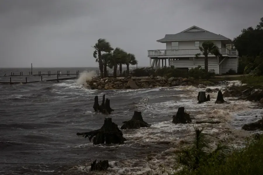Hurricane storm surge pounding a Gulf coast waterfront home near Venice, FL